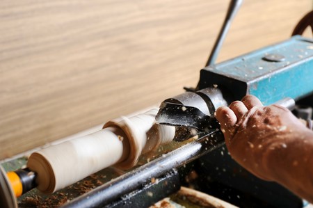 Making a master wood elements on the latheの写真素材