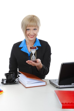 Businesswoman with an hourglass. Isolated on white backgroundの写真素材