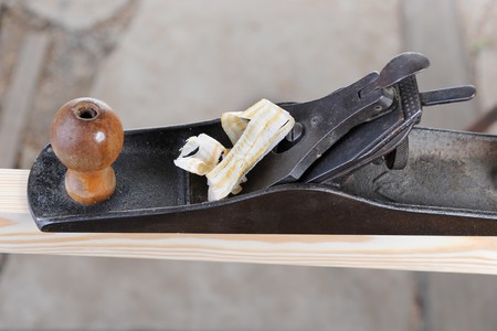 Planer with the chips on a pine boardの写真素材