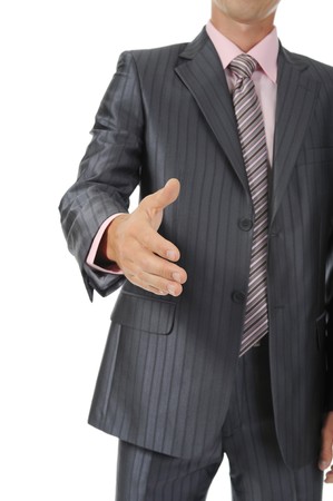 Businessman holds out his hand for a handshake. Isolated on whiteの写真素材