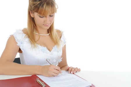 bride puts his signature. Isolated on white backgroundの写真素材