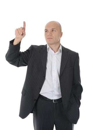 Businessman points finger up. Isolated on white backgroundの写真素材