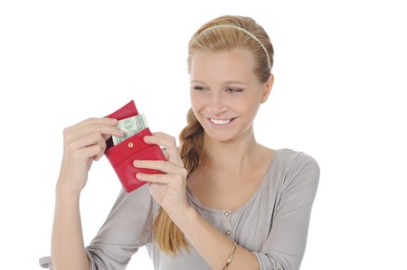 Young long-haired woman gets out of the pouch dollar banknotes. Isolated on whiteの写真素材