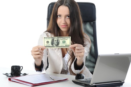 Joyful businesswoman in the office with  dollar banknotes. Isolated on whiteの写真素材
