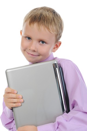 Happy little boy with laptop. Isolated on white backgroundの写真素材
