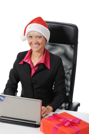 beautiful young woman in Christmas hat. Isolated on white backgroundの写真素材