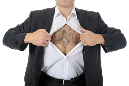 businessman tears open his shirt. Isolated on whiteの写真素材