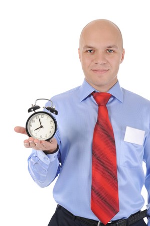 man with an alarm clock in a hand. Isolated on white backgroundの写真素材