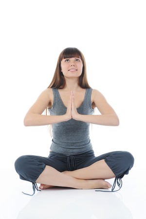 Healthy fitness yoga woman exercising. Isolated on white backgroundの写真素材