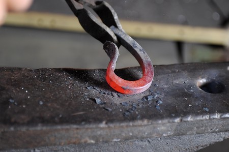 Incandescent element in the smithy on the anvilの写真素材