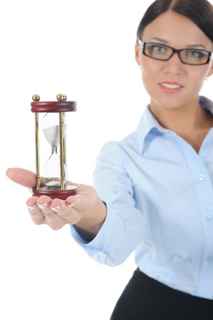 Portrait of a young businesswoman with an hourglass in his hand. Isolated on white background