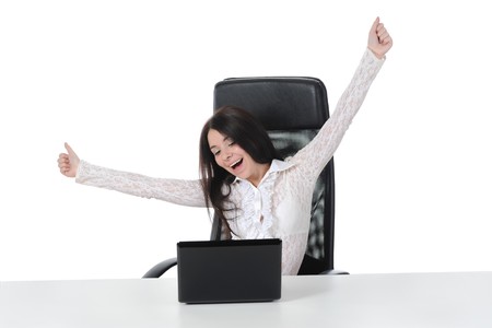 Smiling woman with laptop in a bright office. Isolated on white backgroundの写真素材