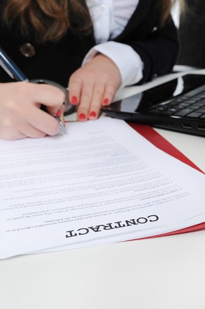 Image of business woman signing a contractの写真素材