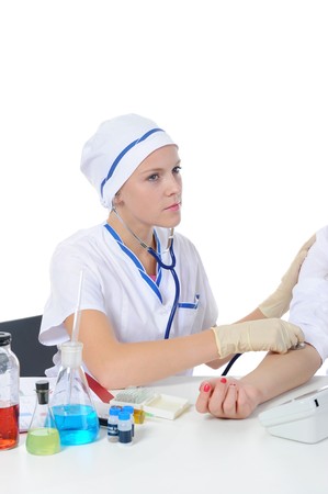 young nurse makes the patient an injection. Isolated on white backgroundの写真素材