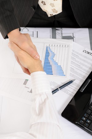 Handshake of business partners, when signing contract.の写真素材