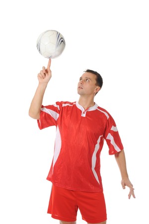 Football player spinning ball on fingerlens. Isolated on white backgroundの写真素材
