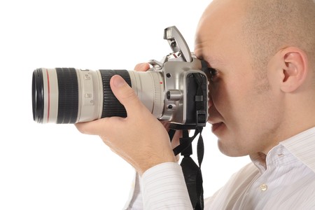 man holds a camera
