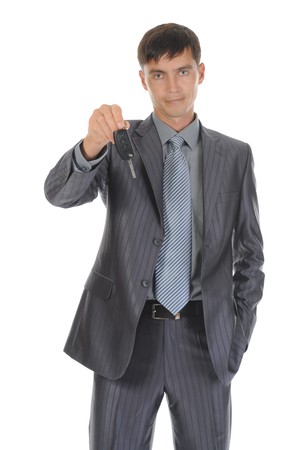 Businessman gives the keys to the carの写真素材