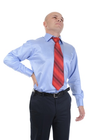 Young businessman with strong back pain. Isolated on white backgroundの写真素材