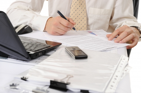 Close-up of business person hands working with documentの写真素材