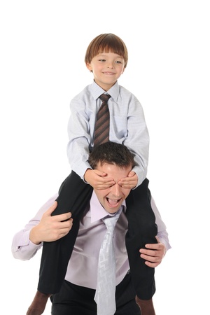 lucky son sitting on his father stretches. Isolated on white backgroundの写真素材