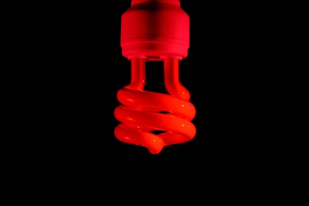 Energy saving bulb. Isolated on black backgroundの写真素材