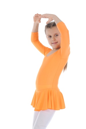 beautiful ballerina dancing in an orange dress. Isolated on white backgroundの写真素材
