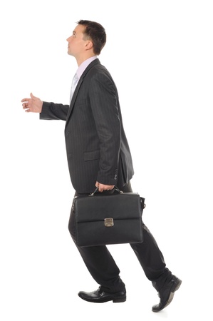 Businessman runs up the career ladder. Isolated on white backgroundの写真素材