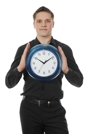 man in a black shirt holds clockの写真素材