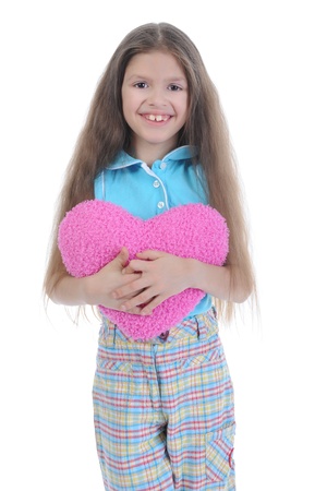 Little girl holding heart. Isolated on white backgroundの写真素材