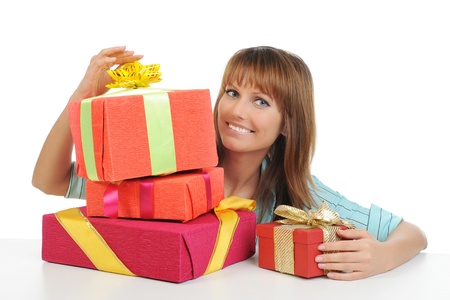 smiling woman with a gift box. Isolated on white backgroundの写真素材