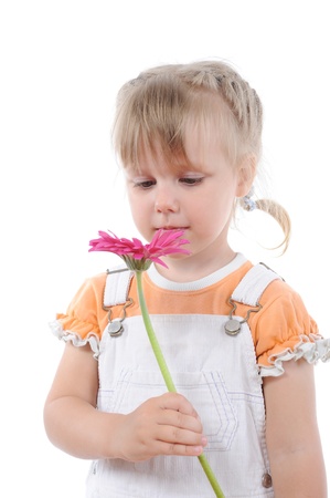 girl sniffs a flower.の写真素材