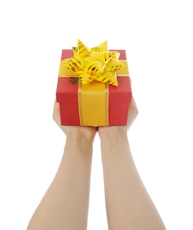 Box with a gift in the hands of womenの写真素材