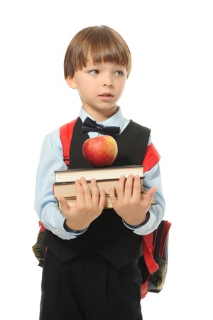 boy holds a stack of booksの写真素材