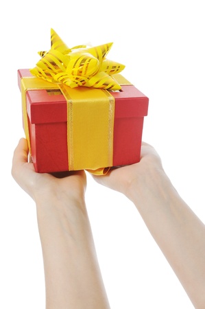 Box with a gift in the hands of womenの写真素材