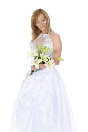 Happy bride with a bouquet of liliesの写真素材