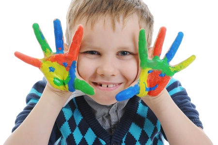 smiling boy with the palms painted by a paint.の写真素材