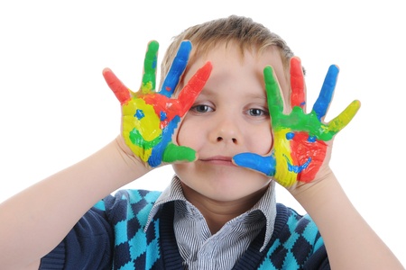 smiling boy with the palms painted by a paint.の写真素材