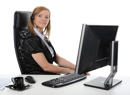 Beautiful girl operator at the computer.の写真素材