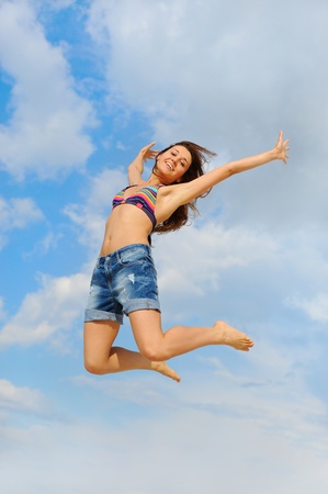 Beautiful Woman over blue Skyの写真素材