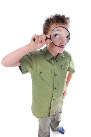 boy looking through a magnifying glassの写真素材