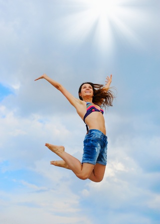 Beautiful Woman over blue Skyの写真素材
