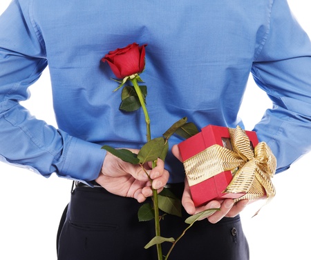 man with a gift box and a roseの写真素材