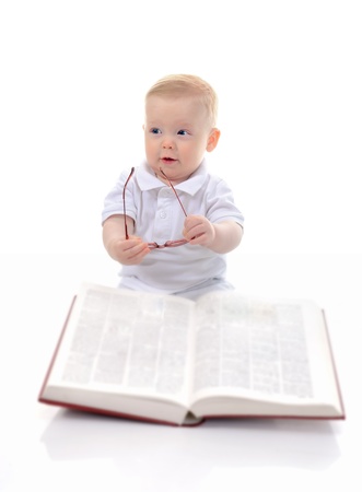 Little boy reads a big bookの写真素材