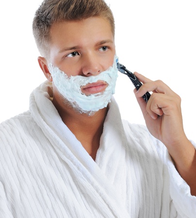 Young man shavingの写真素材