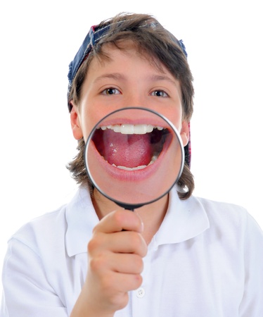 boy looking through a magnifying glassの写真素材