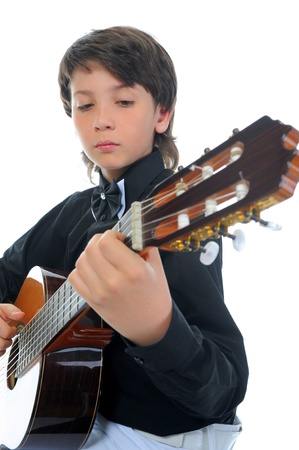 Little boy musician playing guitarの写真素材