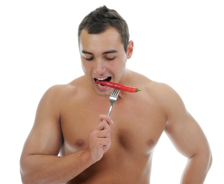 Bodybuilder eating chiliの写真素材