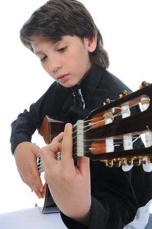 Little boy musician playing guitarの写真素材