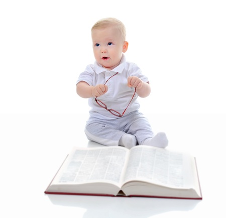 Little boy reads a big bookの写真素材